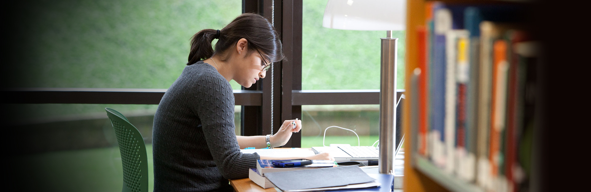 female student studying in UConn Health library