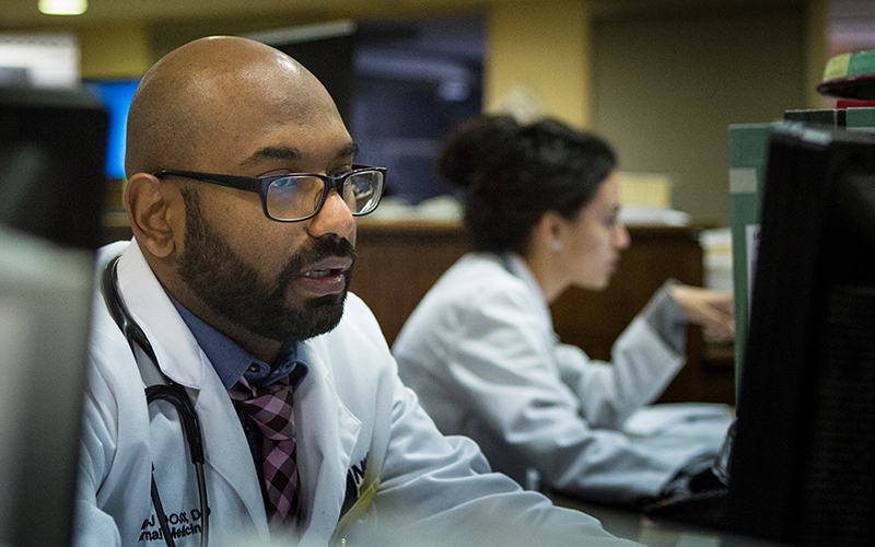 UConn Health medical professional researching on computer