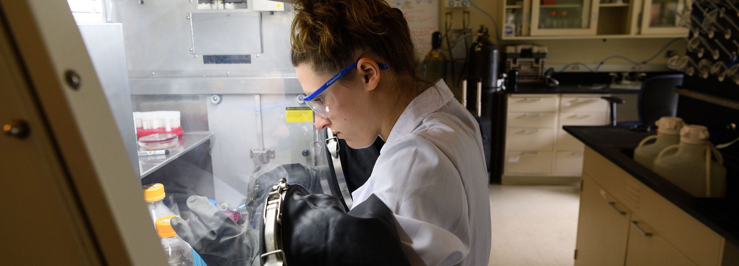 woman uses h-tech science equipment