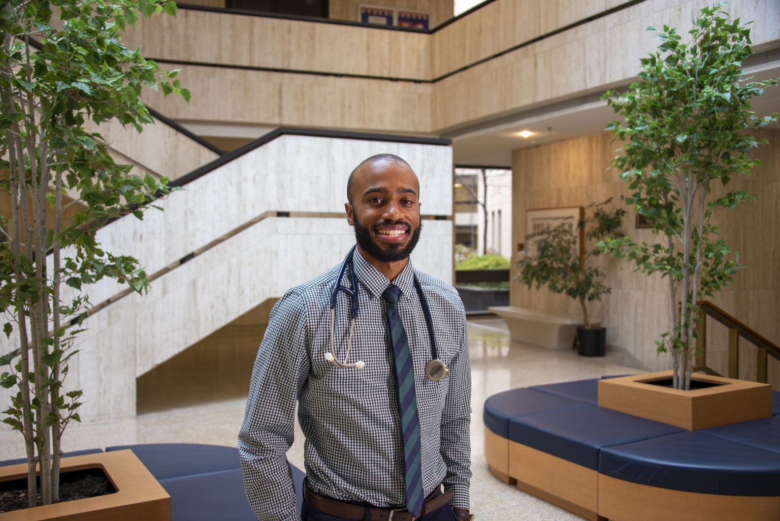 Suleiman Abiola holds a stethoscope gift given to each medical student by alumni from the UConn School of Medicine. November 23, 2020 (Tina Encarnacion/UConn Health photo)