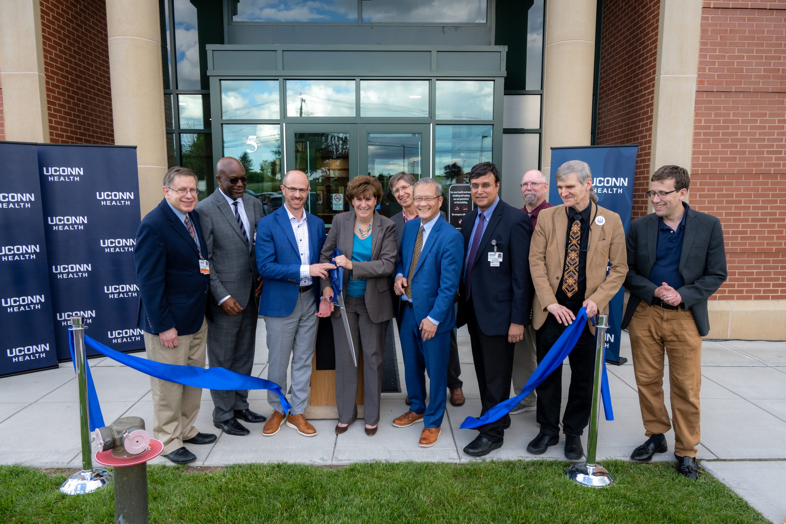 Anne Horbatuck cuts the ribbon at the grand opening celebration of The Brain and Spine Institute a